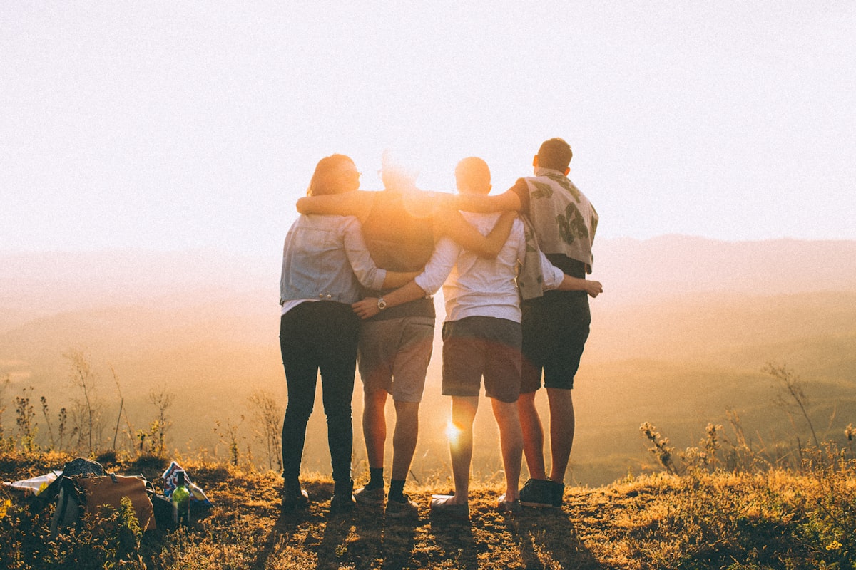 People gathering around a table in a social setting — stock ambiance